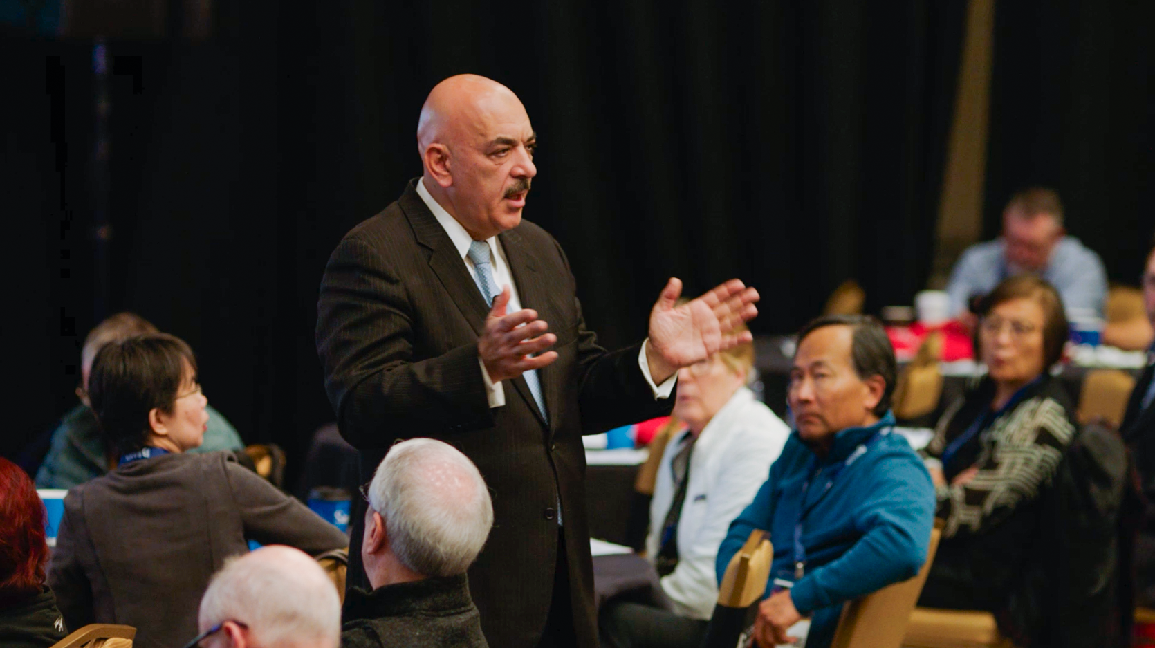 Anas Alhajji speaker with attendees